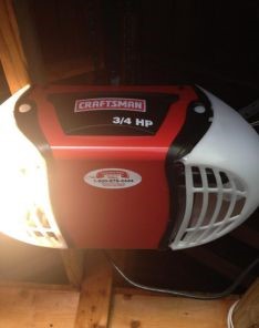 Close-up of a newly installed Craftsman 3/4 HP electric garage door opener mounted inside a Casa Grande garage, highlighting the modern upgrade.